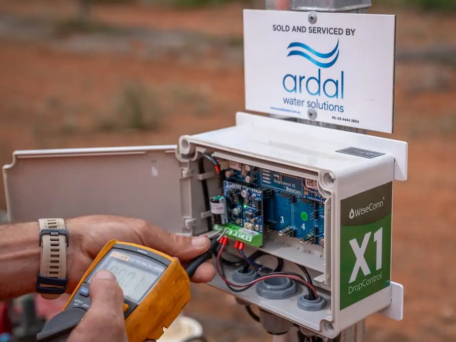 Ardal technician testing a WiseConn X1 controller in the field